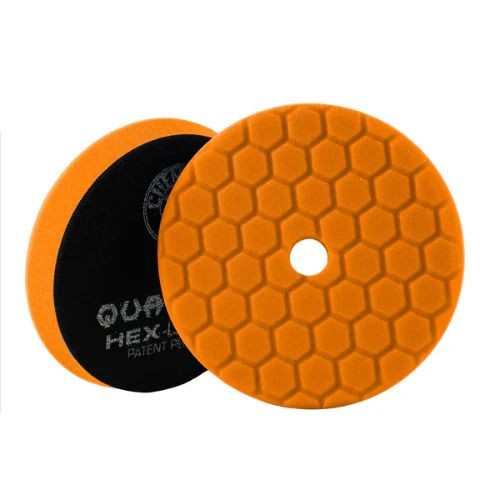 Two orange hexagon-patterned foam pads with a central hole, one showing the black backing.