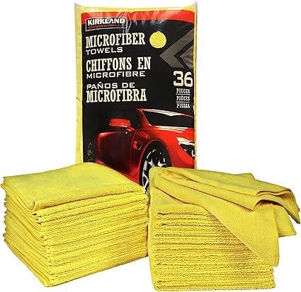 Stack of yellow microfiber towels with a package showing a red car and '36 pieces' label.